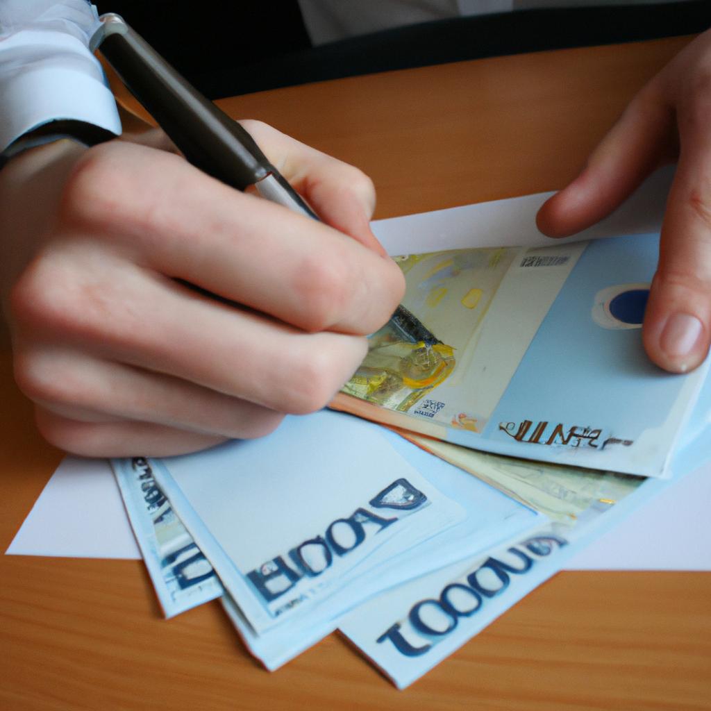Person holding money, signing papers